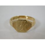 An inscribed 9ct gold signet ring