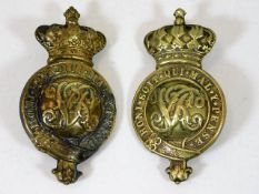 A pair of Victorian brass military badges