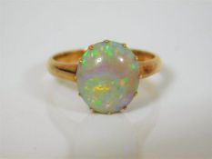 An early 20thC. 18ct gold ring set with large opal