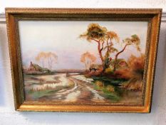A landscape oil on canvas inscribed in pencil to verso George Oyston 1928 725/3