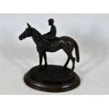 A bronze horse & jockey sculpture