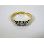 An 18ct gold diamond trilogy ring with platinum mo