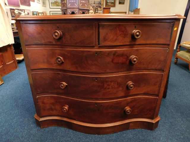 A 19thC. mahogany serpentine chest of drawers, cru