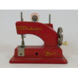 A small child's Vulcan sewing machine