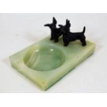 A pair of painted bronze Scottie dogs on onyx trin