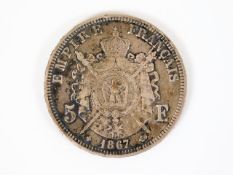 An 1867 silver Napoleon III silver five francs
