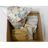 A boxed quantity of loose stamps