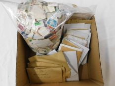 A boxed quantity of loose stamps