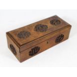 An antique Chinese wooden box with carved roundels