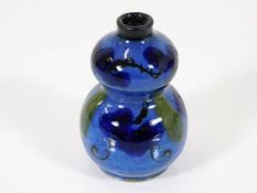 An early 20thC. Chinese glazed earthenware double gourd snuff bottle lacking stopper