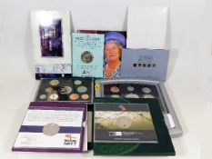 A quantity of various commemorative coin sets & si
