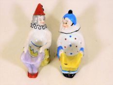 A pair of c.1900 Sitzendorf porcelain clown pipe s