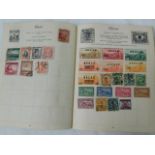 Four small stamp albums & a quantity of loose stam