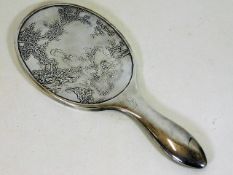 A 19thC. Chinese silver mirror with relief decor