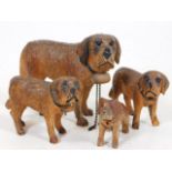 A carved Black Forest style family of St. Bernard