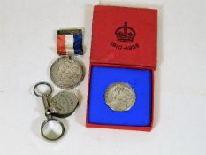 A silver commemorative medal, one other commemorat