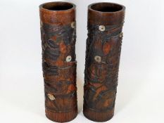 A pair of Oriental carved bamboo brush pots with m