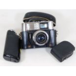 A Voigtlander Vitrona camera with accessories