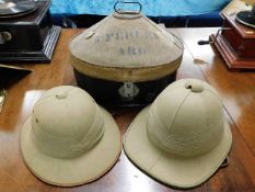 An Allibhoy Vallijee & Sons steel hat box & two Hawkes & Co. British pith helmets belonging to Major
