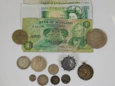 Three one pound notes, a five pound coin, a George