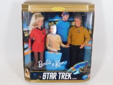 A Barbie & Ken Star Trek boxed figure set