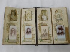 A Victorian photograph card album