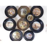 A collection of nine mounted Staffordshire pot lids including Crimean War bear, lion & cockerel & th