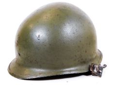 A post WWII M1 style helmet, probably Austrian