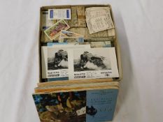 A boxed quantity of tea cards including four album