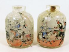 A pair of 19thC. Peking glass reverse painted snuff bottles, some cracking to top & base