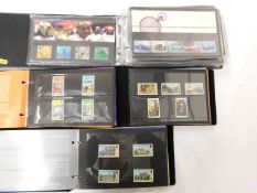 Four albums of mint stamps including three Guernse