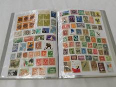 A world stamp album, mostly mint