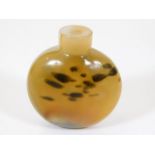 An antique Chinese carved agate snuff bottle lacki