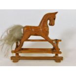 A carved model of rocking horse