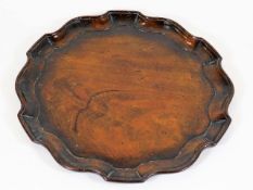 An 18thC. George III Chippendale mahogany butler t
