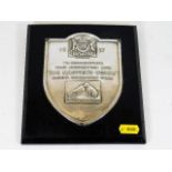 A mounted His Masters Voice silver plaque commemor