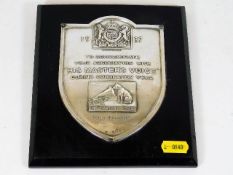 A mounted His Masters Voice silver plaque commemor