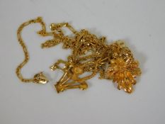 Two yellow metal chains & pendants
