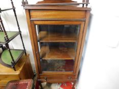 A mahogany glazed display cabinet with drawer