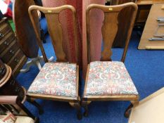 A pair of mahogany dining chairs with mackintosh s