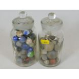 Two jars of antique marbles