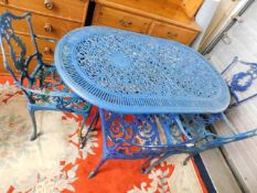 A painted metal garden table with four chairs & tw