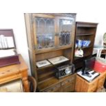 A glazed oak dresser with drawers & cupboard under