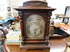 An German oak cased mantle clock