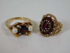 A 9ct gold ring with pearl & garnet twinned with a