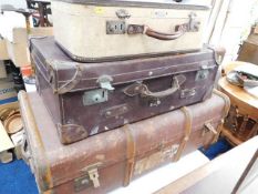 A large wooden bound travel case, a leather corner
