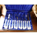 A boxed porcelain handled cutlery set, some a/f
