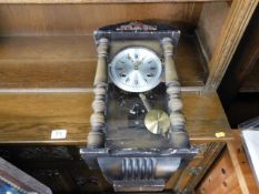 A 20thC. wall clock with silvered dial