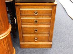 A small oak style chest of drawers