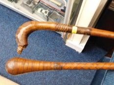 Two ethnic leather walking canes
